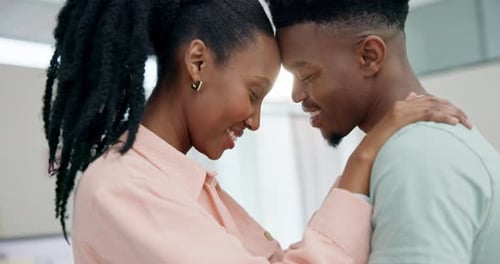 Loving Couple Embraces with Foreheads Touching