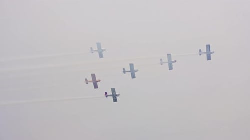 Planes Fly in Formation on a Cloudy Day