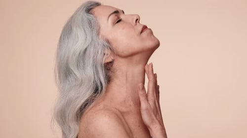 Elegant Senior Woman Caressing Her Face