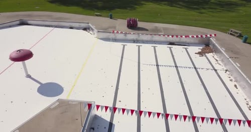 Closed empty water park with water slides and splash areas recreational water play space shut down o