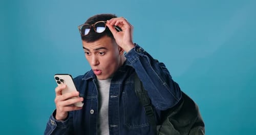 Surprised Young Adult Reacting to Phone Message