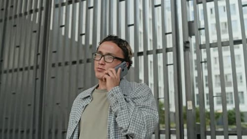 Gen Z Businessman Calling on Smartphone Walking on City Street