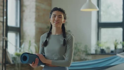 Portrait of Asian Woman in Yoga Studio