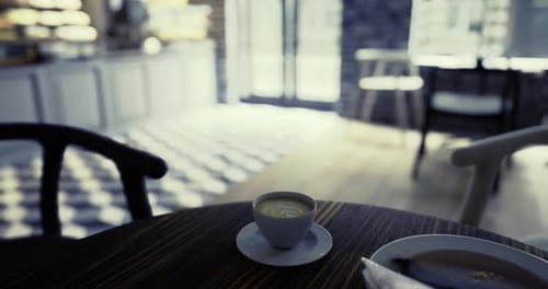 Cozy Cafe Corner with Coffee and Pastry Served in Modern Interior Space