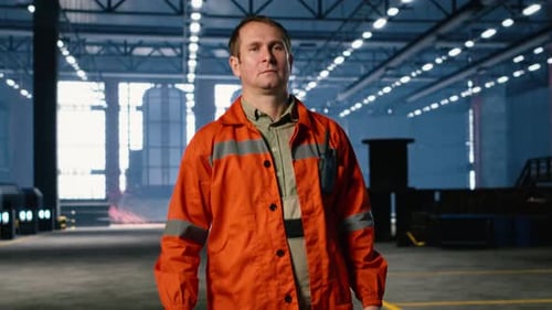 Industrial Supervisor Walking Around Factory Floor and Overseeing Assembly Teams