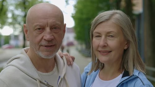 Smiling Senior Couple Standing Together Outdoors