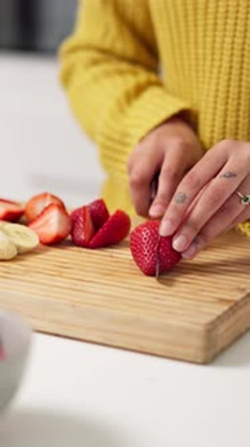 Woman Cutting Fresh Strawberries on Wooden Cutting Board