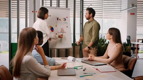 Young Asian Office Worker Gives Speech at Business Meeting