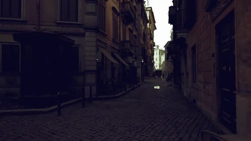 Quiet Cobblestone Passage Illuminated By Lanterns at Twilight