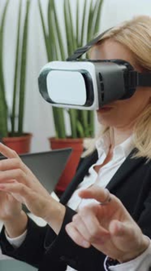 Woman using VR Headset in Modern Office