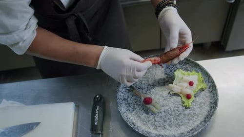 Chef Preparing Gourmet Seafood Dish in Restaurant Kitchen