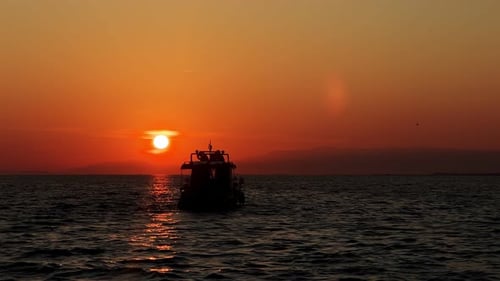 The Boat And People Silhouette In Sea In Sunset 1