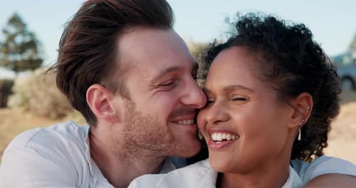 Smiling Couple Embracing on Sunny Day