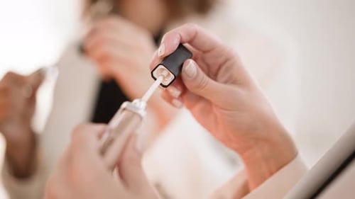 Woman Opens Lip Gloss Tube Close Up