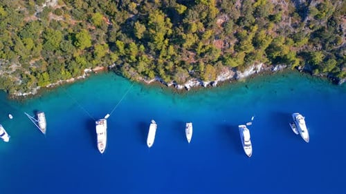 Aerial view of turquoise water and boats, Turkey.