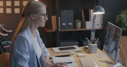 Businesspeople Man and Woman Talking During Online Video Call Using Computer Concentrated on Virtual