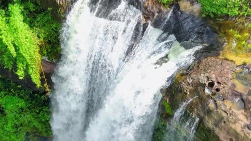 Stunning waterfall in a tropical forest from a bird's eye view.