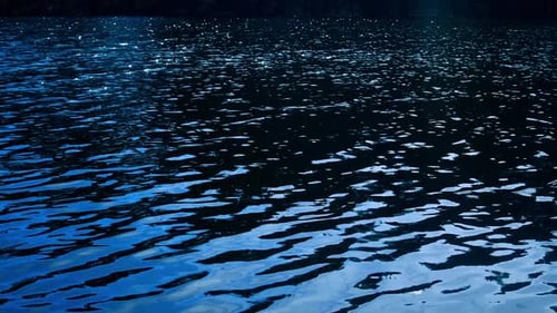 Rippling Blue Water Reflecting Light on Lake Surface