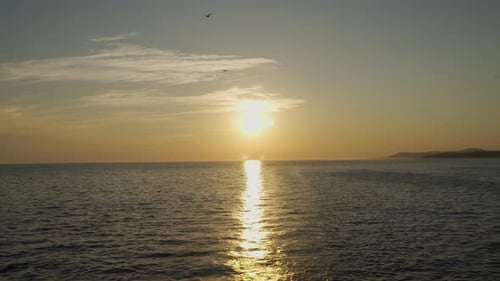 Golden Sunset Over Still Ocean Waters
