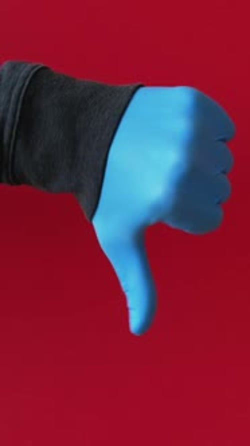 Hand in Blue Glove Gives Thumbs Up and Down