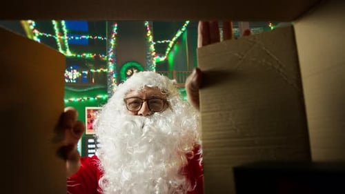 Man Dressed as Santa Claus Opens Box