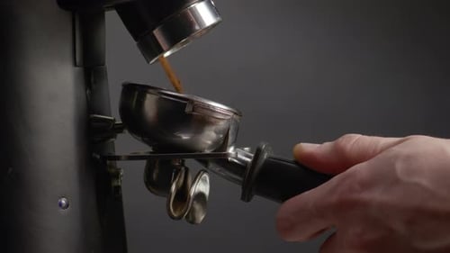 Filling Portafilter with Ground Coffee From Espresso Machine