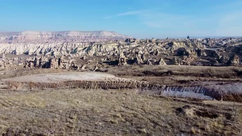 Fairy Chimneys in the Goreme Valley of Cappadocia and the Mountains in the Background
