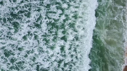 Stormy Sea Water Crashing of Sandy Beach Slow Motion Ocean Waves Surf Rolling