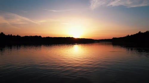 Aerial View of a Lake with People Relaxing on Theon the White Sand Beach and Driveway with Parking