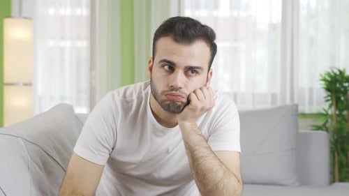 Unhappy young man sad and sad.