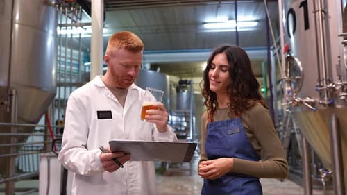 Quality Control Inspector Testing Beer at Brewery