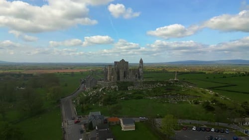 Aerial view of the Rock of Cashel, capturing ancient stone walls, round towers, and cathedral ruins