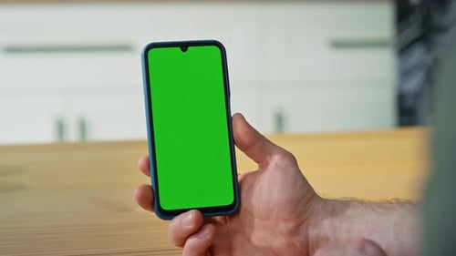 Person Taps and Swipes Green Screen Cell Phone