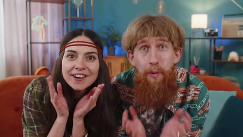 Surprised Man and Woman React Together Indoors