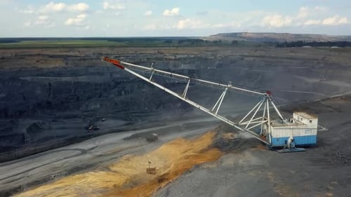 Heavy Machinery Actively Operating at a Coal Mine During Extraction and Production Activities Stock
