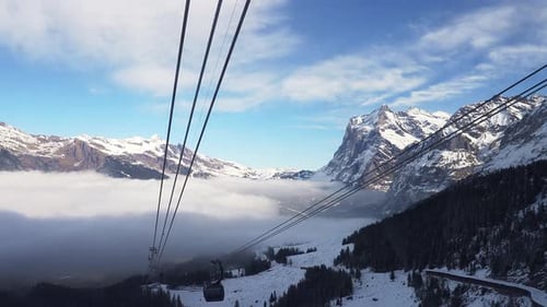 Ski Chair Lift with a View of the Summit and the Slopes