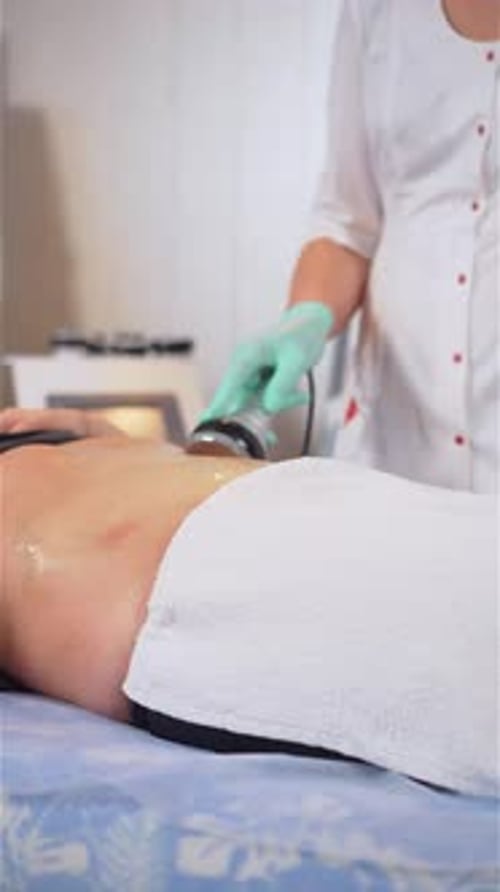 Medical Professional Treating Patient in Clinic