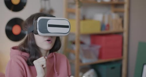 Woman Using Virtual Reality Headset in Home
