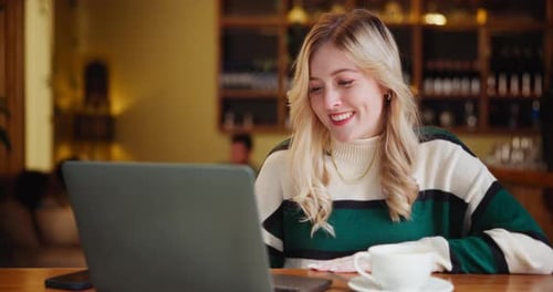 Freelancer, smile and woman with laptop in coffee shop for remote work, planning