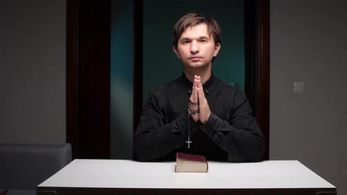 Man with Rosary Praying at Table