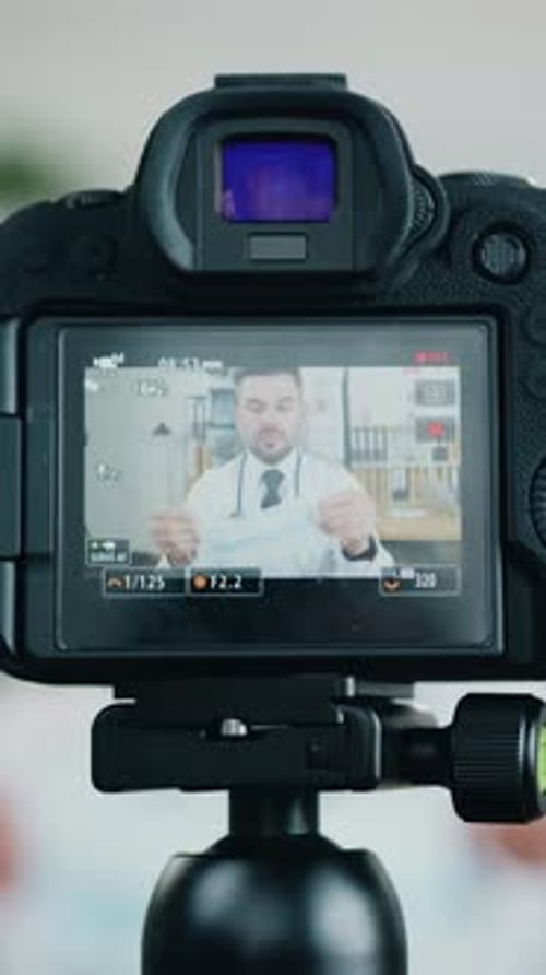 Professional Camera Shooting on Likable Man Doctor Medic Which Showing for Viewers of Medical