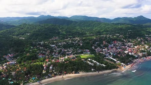 Aerial View of Tropical Beach and Coastal Town