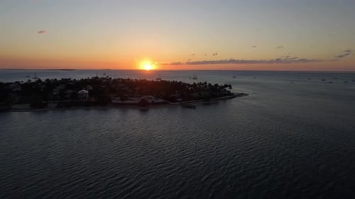 Sunset Behind Luxury Homes On Tropical Island