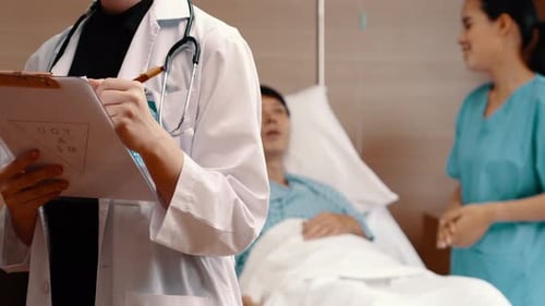 Portrait of doctor female with medical while nurse and take care of male patient in hospital.