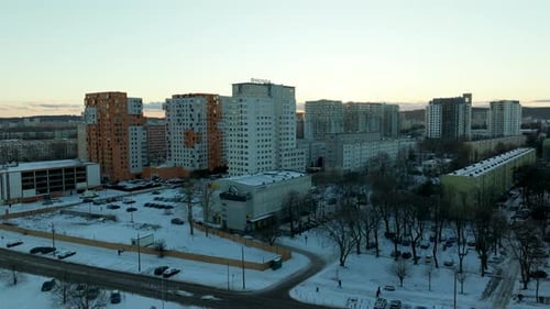 Snow-Covered City Skylines During Sunset In Przymorze, Gdańsk County, Poland. Aerial Tilt-up Shot