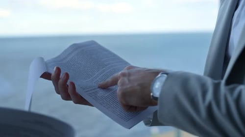 Closeup Hands Checking Contract Papers. Nervous Client Pointing Legal Mistakes at Ocean