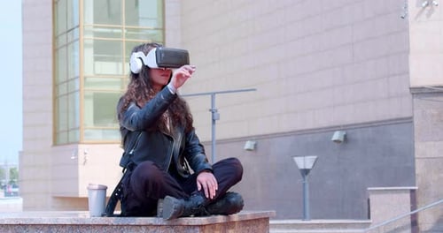 Woman Using VR Headset in City Environment