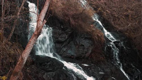 Fresh Water Flowing Down On The Waterfalls In The Mountain. - aerial, closeup shot