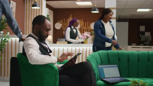 African American Staff Making Bookings