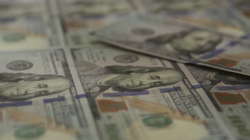 Close Up of Scattered Hundred Dollar Bills